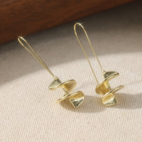 Gouden statement oorbellen met blad motief