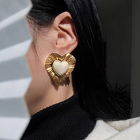 Gouden vintage hartoorbellen met parel