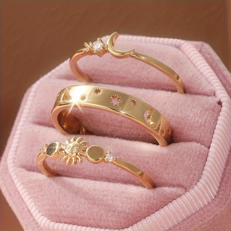 Gouden ringenset met zon, maan en sterren