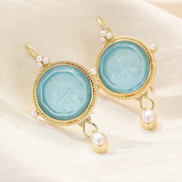 Gouden vintage oorbellen met turquoise steen en parels
