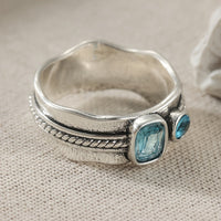 Zilveren ring met twee aquablauwe edelstenen
