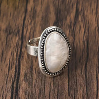 Zilveren ring met grote lichtblauwe ovale steen