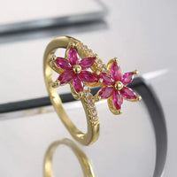 Gouden ring met twee roze zirkonia bloemen