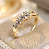 Gouden ring met drie rijen zirkonia
