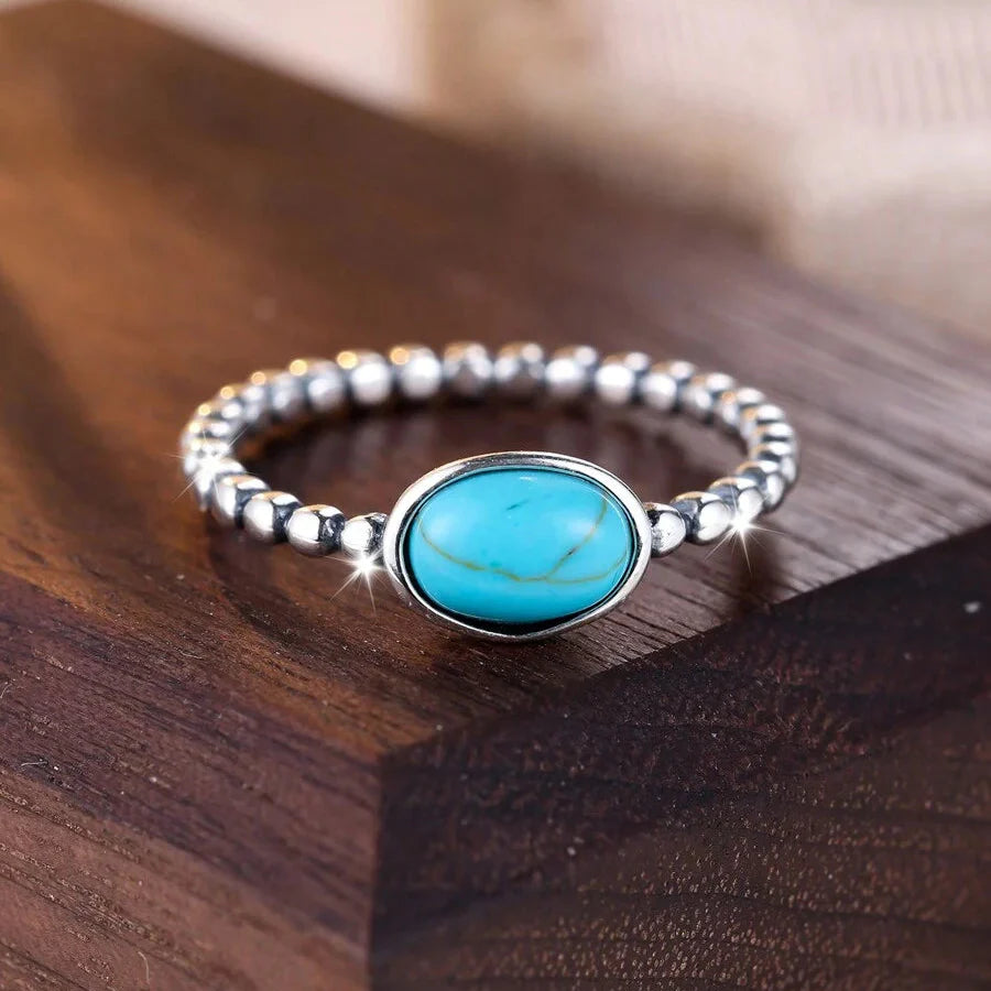Zilveren minimalistische ring met ovale turkooizen steen
