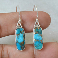 Zilveren oorbellen met rechthoekige turquoise steen