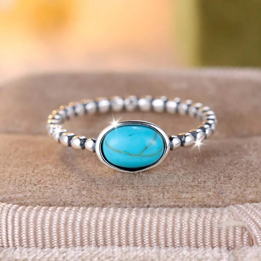 Zilveren minimalistische ring met ovale turkooizen steen
