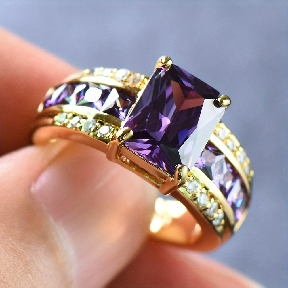 Gouden ring met vierkante paarse zirkonia
