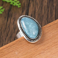 Zilveren ring met grote lichtblauwe ovale steen