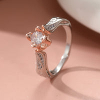 Tweekleurige zilveren en roségouden ring met zirkonia