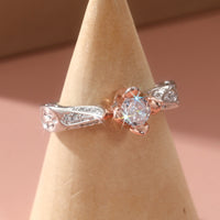 Tweekleurige zilveren en roségouden ring met zirkonia