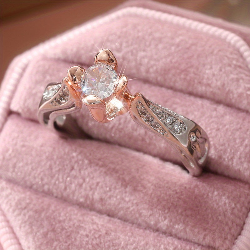 Tweekleurige zilveren en roségouden ring met zirkonia