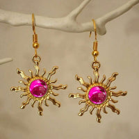 Gouden zonoorbellen met amber cabochon