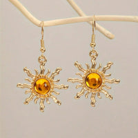 Gouden zonoorbellen met amber cabochon