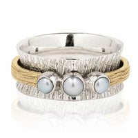 Zilveren ring met parels en goudkleurige spinner band