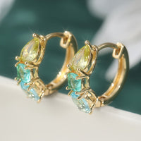 Gouden oorbellen met gele en blauwgroene edelstenen