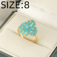 Gouden ring met turquoise geëmailleerde strepen