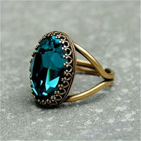 Gouden vintage ring met blauwe edelsteen
