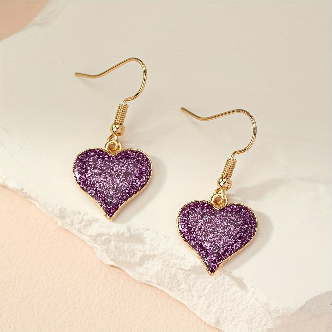 Paarse glitter oorbellen met hart