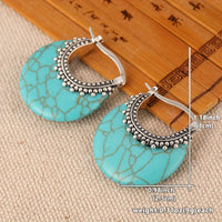 Zilveren bohemian oorbellen met turquoise schijf