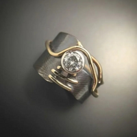 Zilveren ring met gouden draad en helder kristal
