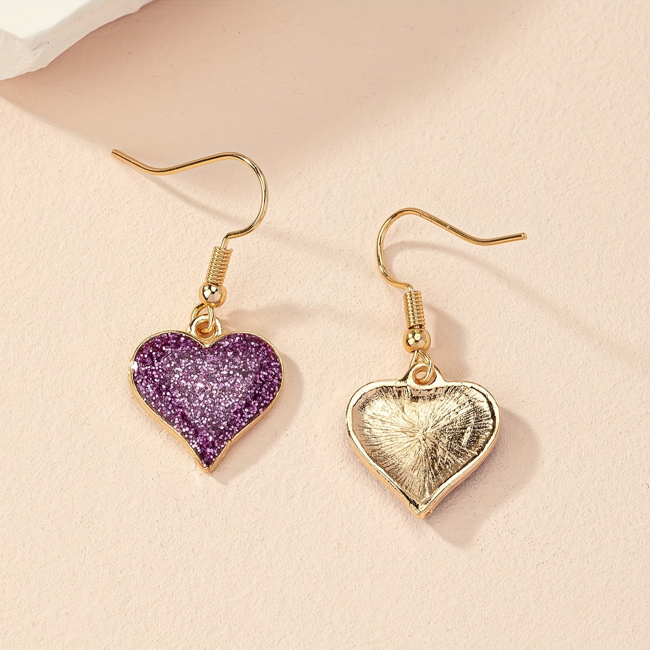 Paarse glitter oorbellen met hart