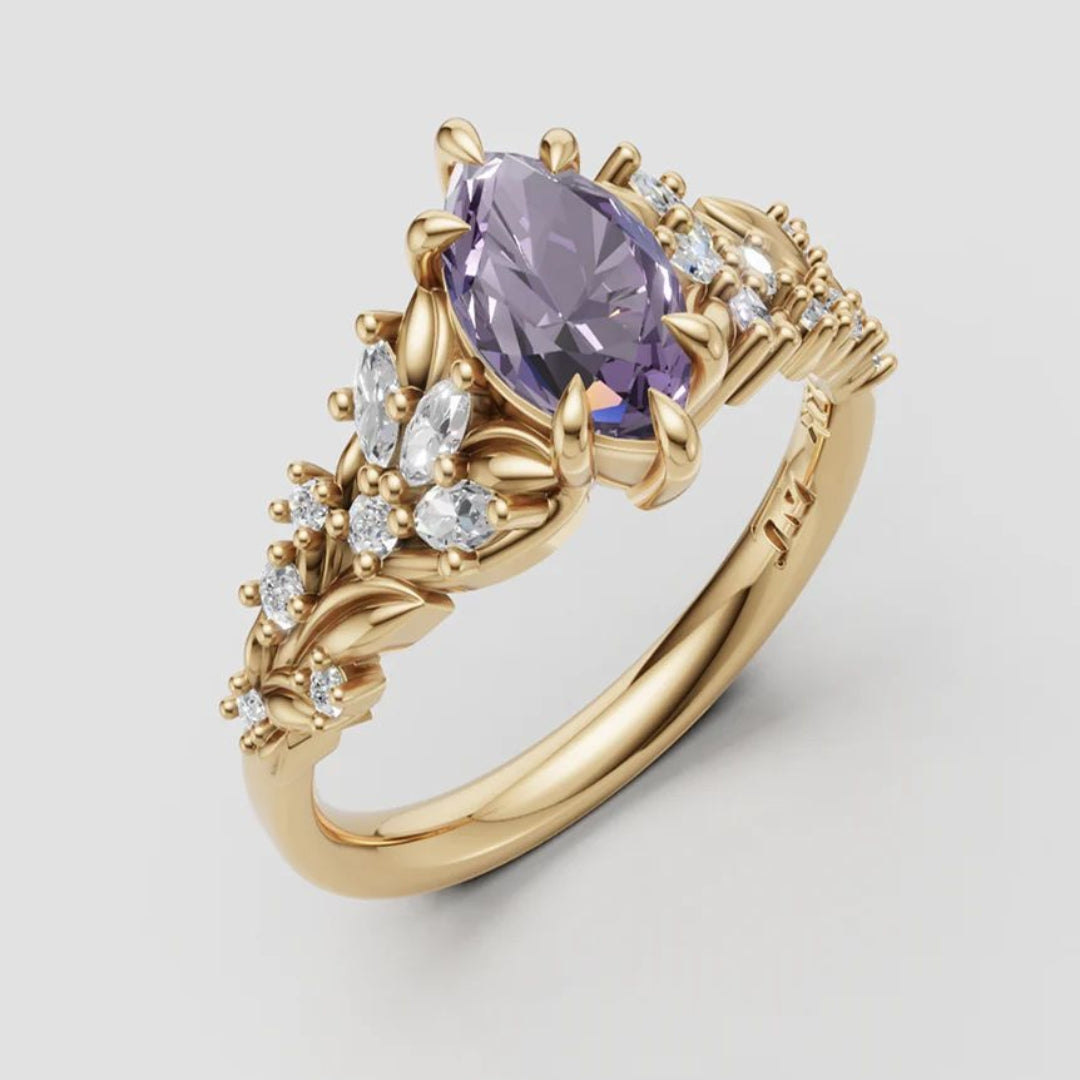 Gouden ring met paarse marquise zirkonia en bladmotief