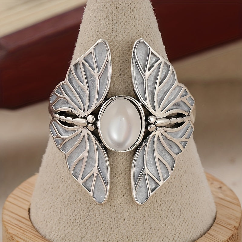 Zilveren vintage vlinderring met witte ovale steen