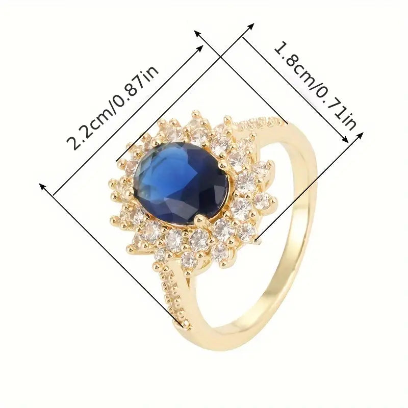 Gouden vintage ring met blauwe steen en zirkonia