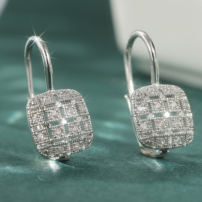 Zilveren vintage oorbellen met geometrisch open vlak en zirkonia