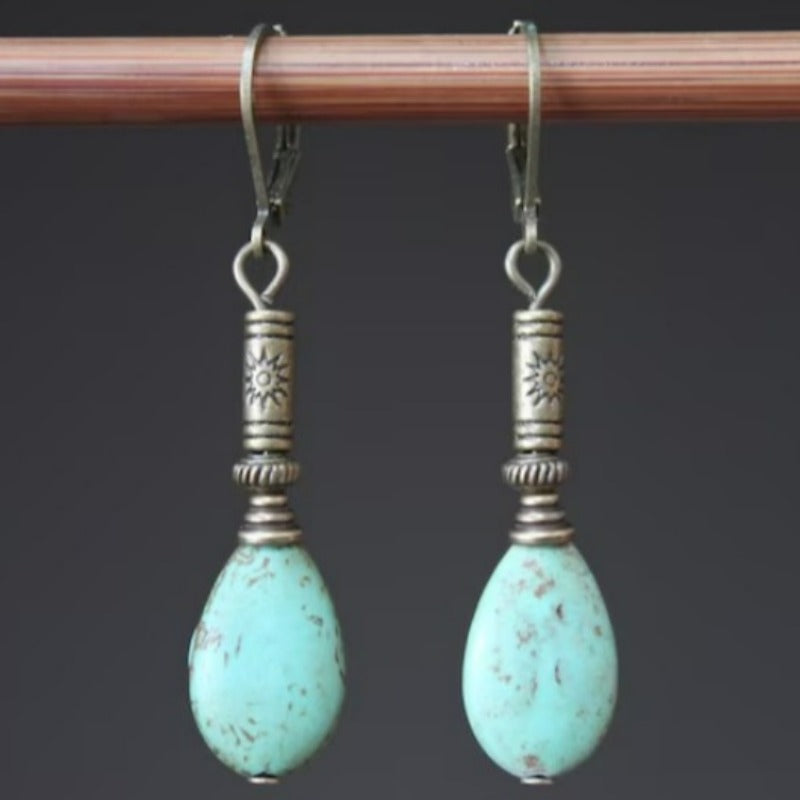 Zilveren etnische oorbellen met turquoise druppel