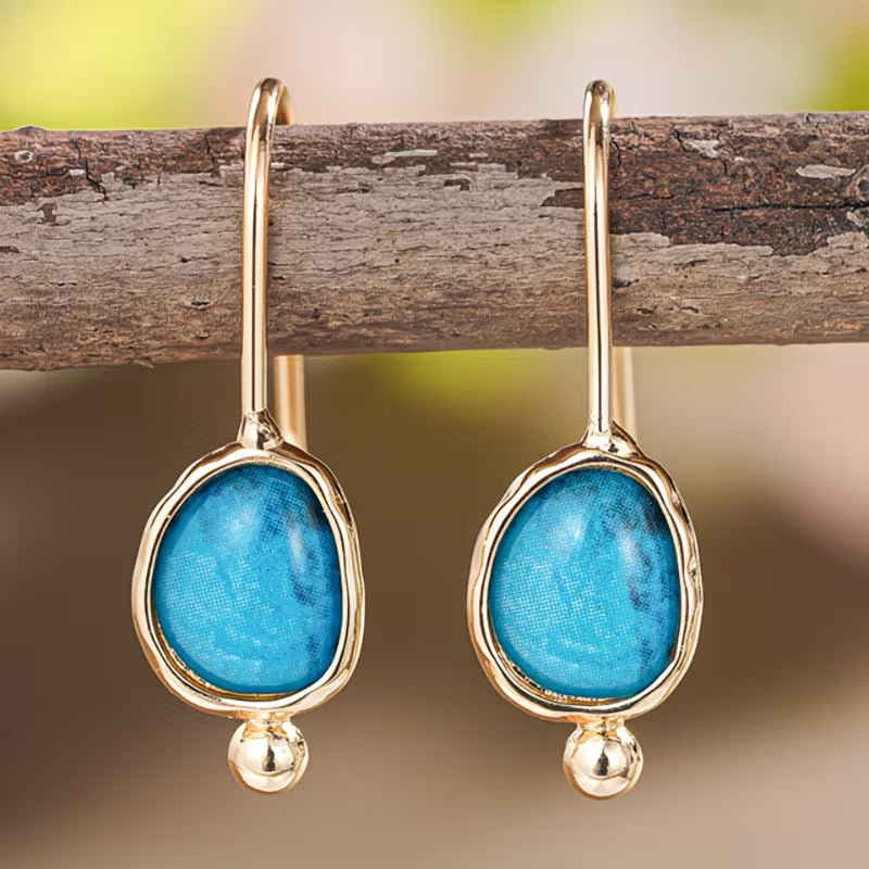 Bohemian oorbellen met blauwe natuursteen hanger
