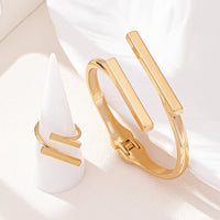 Gouden set met armband en ring met dubbele staaf