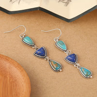 Zilveren oorbellen met turquoise en lapis druppels