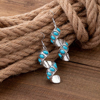 Zilveren oorbellen met spiraal en turquoise