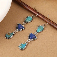 Zilveren oorbellen met turquoise en lapis druppels