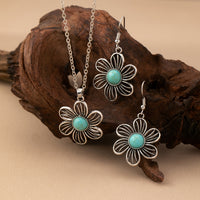 Zilveren bloemenset ketting en oorbellen met turquoise