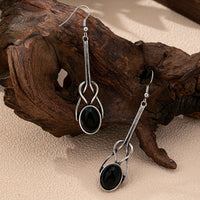 Zilveren vintage oorbellen met zwarte ovale steen