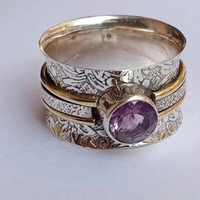 Zilveren spinner ring met paarse amethist