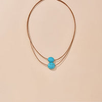 Bohemian ketting met turkooizen hanger en zilveren kwastjes