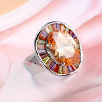Zilveren ring met ovale champagnekleurige en kleurrijke edelstenen