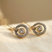 Gouden vintage hangoorbellen met cirkel en zirkonia