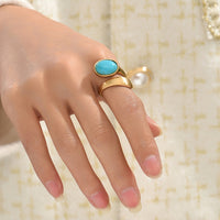 Gouden bypass ring met ovale turquoise steen