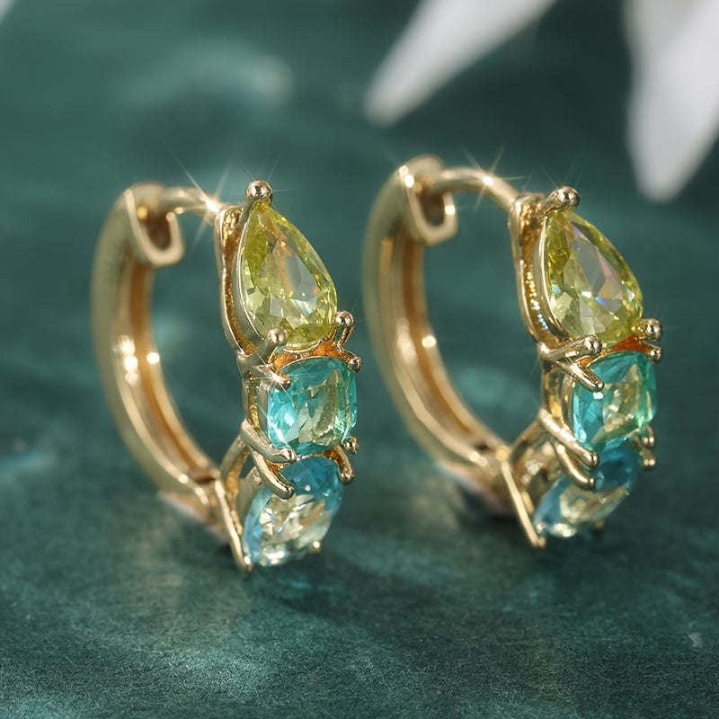 Gouden oorbellen met gele en blauwgroene edelstenen