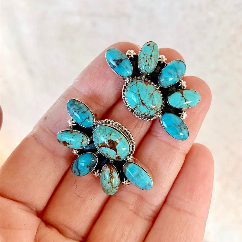 Zilveren oorbellen met ruitvormige turquoise hanger