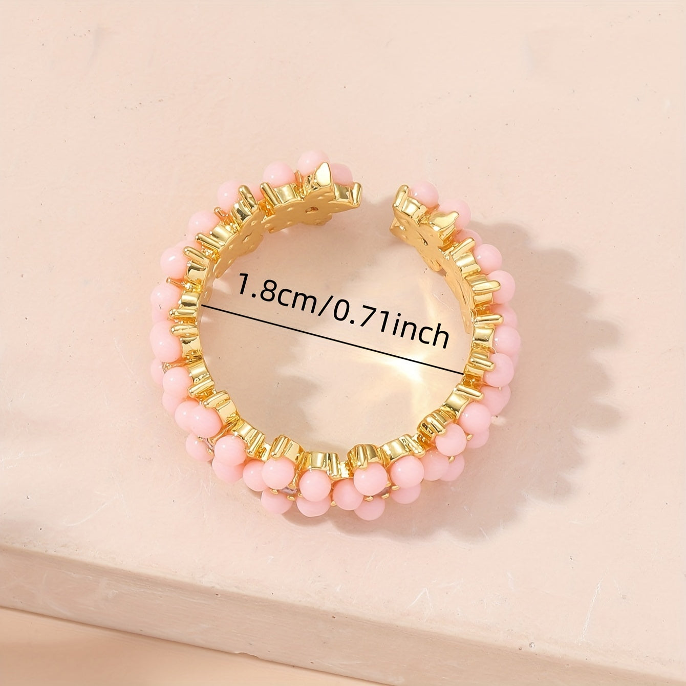 Gouden ring met turquoise kralen bloemmotief