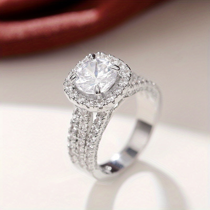 Zilveren halo-ring met ronde zirkonia