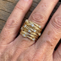 Gouden ring met gevlochten band en zirkonia