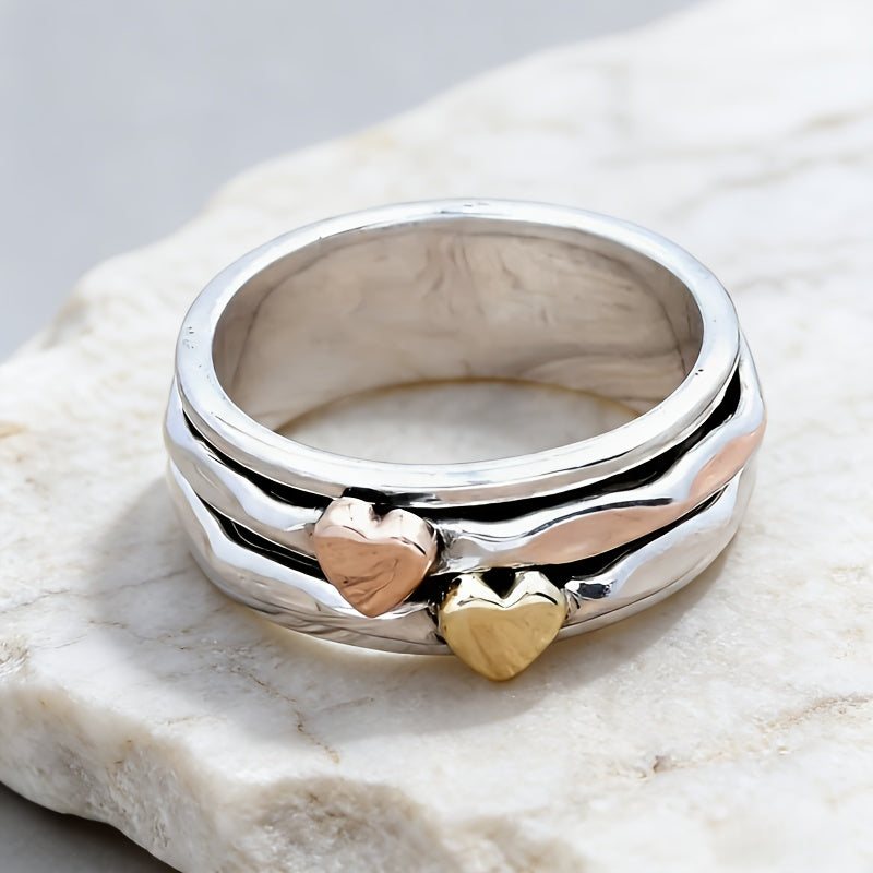 Zilveren brede ring met roségouden en gouden hartjes