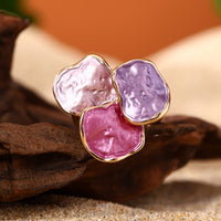 Roségouden ring met roze en paarse edelstenen